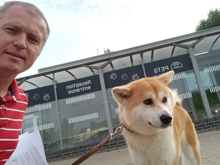 Dog and owner at a pet travel reception point before a UK to France journey